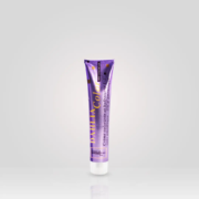 Tube violet de Crème Colorante sans Ammoniaque 100ml, réputée pour son excellent rapport qualité/prix, debout sur fond gris clair—un produit de coiffure professionnel abordable. Dahlia Color Professionnel